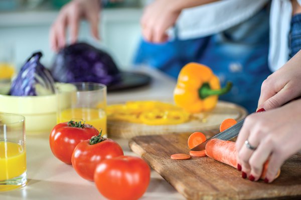Chopping fresh, colorful vegetables for a healthy meal